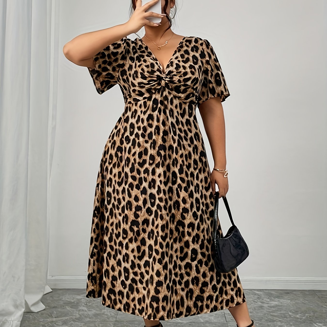 Elegant Leopard Print Midi Dress for Women with V Neck Flutter Sleeve Twist Front Flowing Style