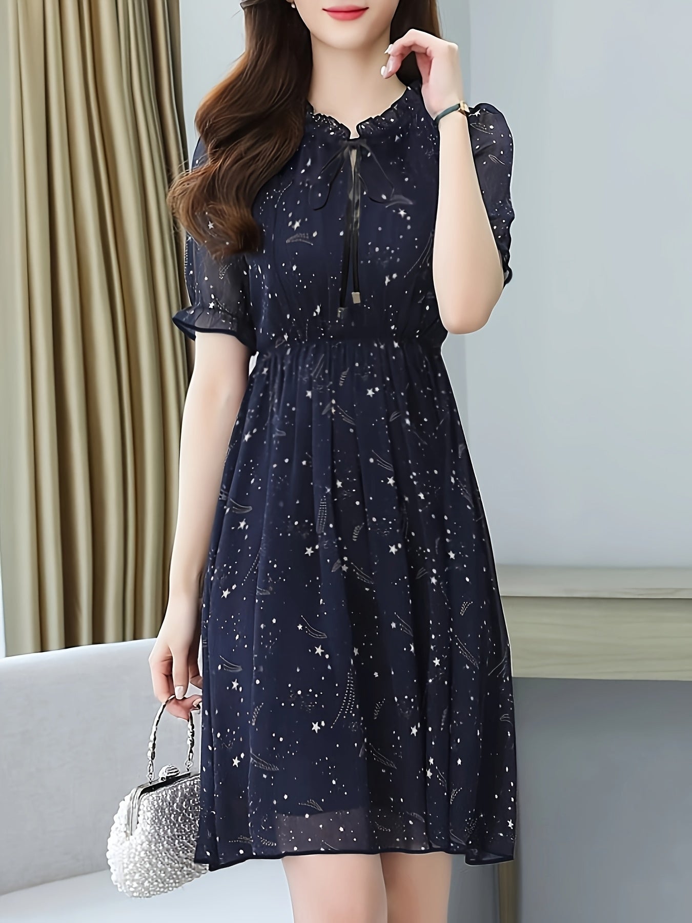 Elegant Navy Star Print Midi Dress for Women with Tie Neck Flutter Sleeve Ruffle Hem Flowing Wedding Guest Style
