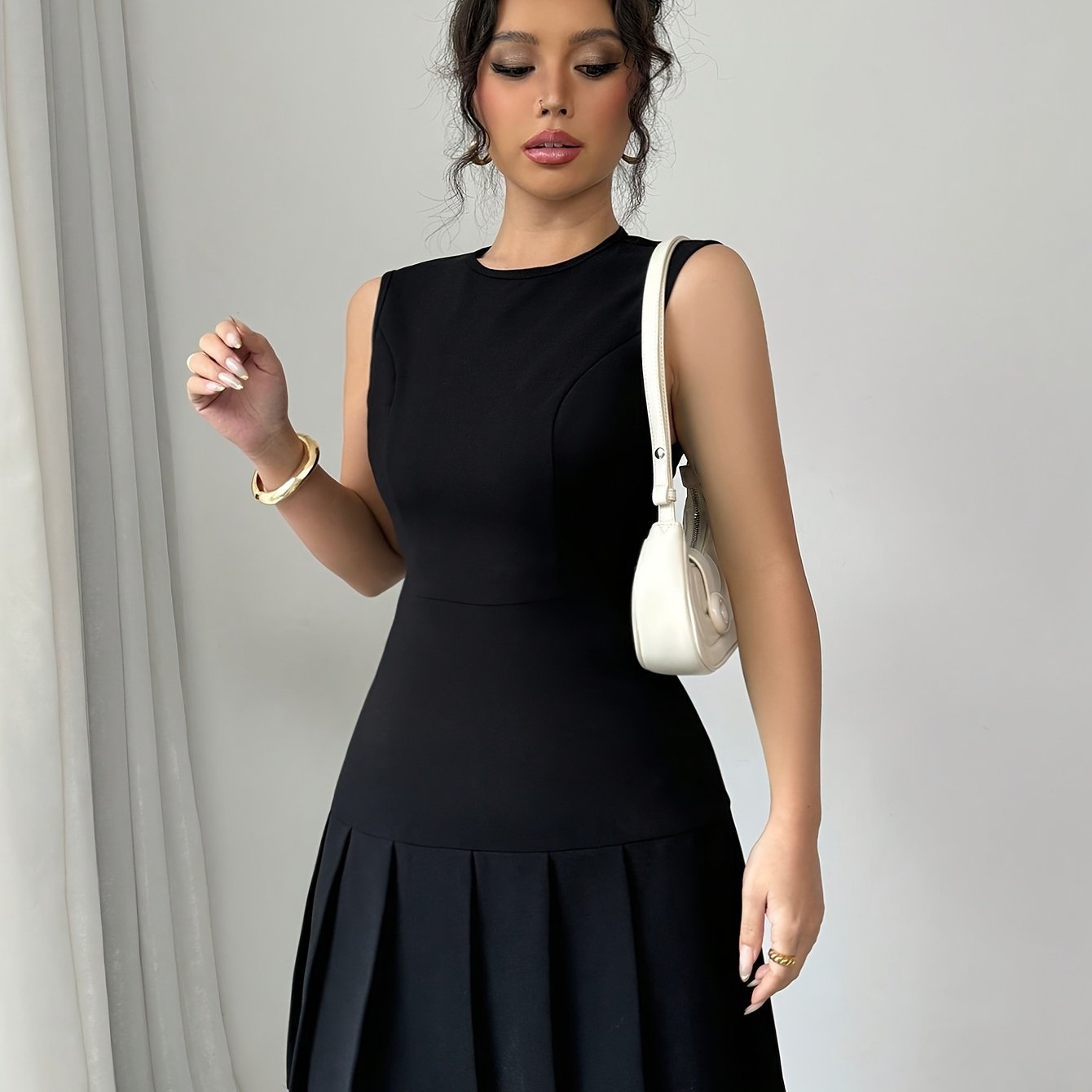 Elegant Pleated Mini Dress for Women with Round Neck Sleeveless Fit and Flare Cocktail Style