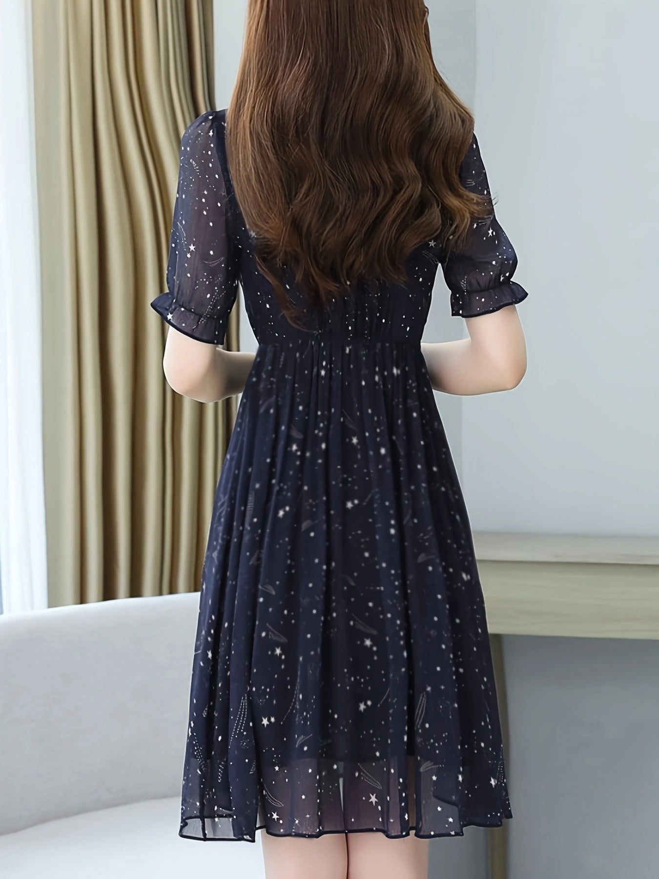 Elegant Navy Star Print Midi Dress for Women with Tie Neck Flutter Sleeve Ruffle Hem Flowing Wedding Guest Style