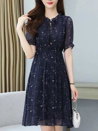 Elegant Navy Star Print Midi Dress for Women with Tie Neck Flutter Sleeve Ruffle Hem Flowing Wedding Guest Style