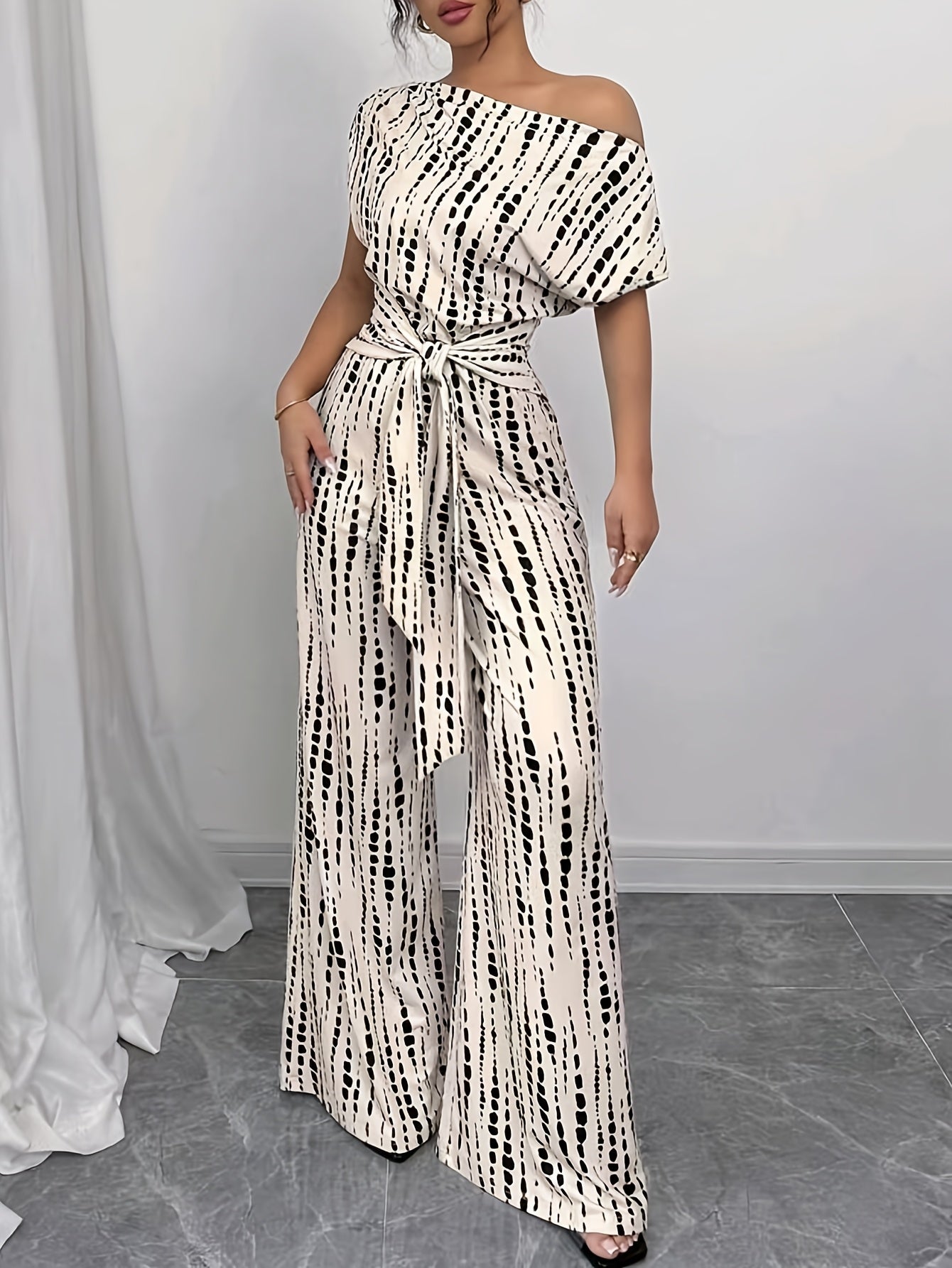 Elegant Apricot Abstract Print Jumpsuit for Women with One Shoulder Short Sleeve Wide Leg Tie Waist Style