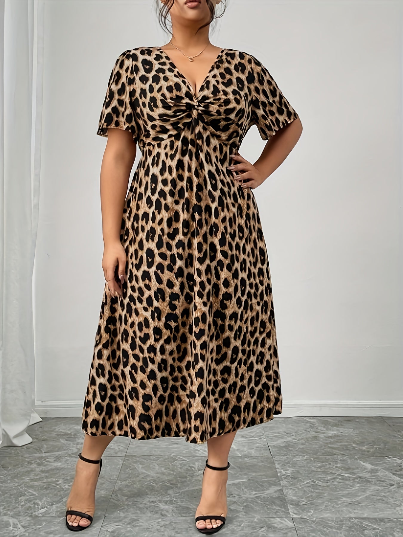 Elegant Leopard Print Midi Dress for Women with V Neck Flutter Sleeve Twist Front Flowing Style