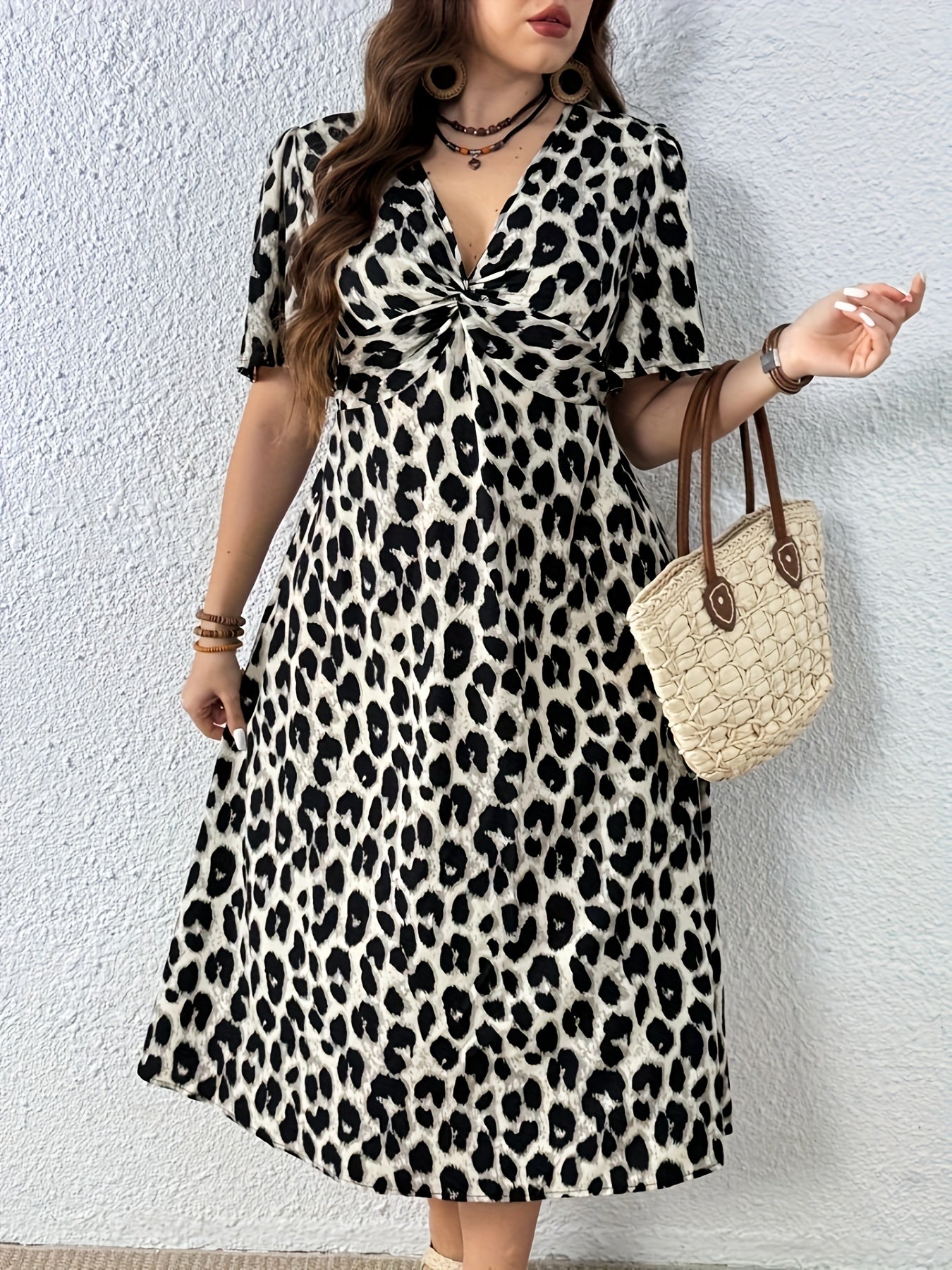 Elegant Leopard Print Midi Dress for Women with V Neck Flutter Sleeve Twist Front Flowing Style