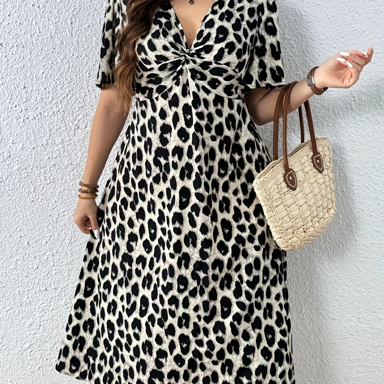 Elegant Leopard Print Midi Dress for Women with V Neck Flutter Sleeve Twist Front Flowing Style