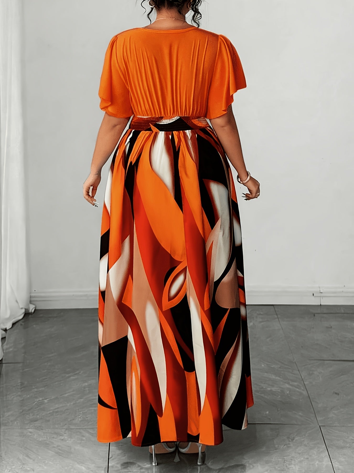 Elegant Orange Geometric Print Maxi Dress for Women with V Neck Flutter Sleeve Wrap Tie Waist Flowing Style