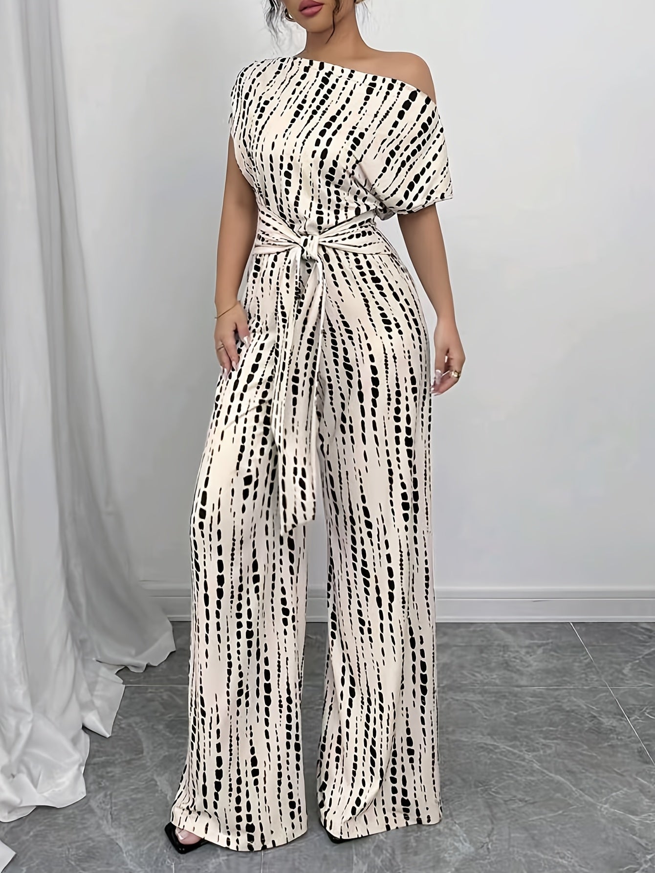 Elegant Apricot Abstract Print Jumpsuit for Women with One Shoulder Short Sleeve Wide Leg Tie Waist Style