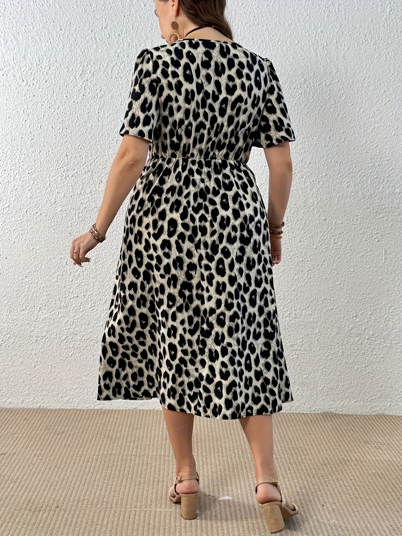 Elegant Leopard Print Midi Dress for Women with V Neck Flutter Sleeve Twist Front Flowing Style